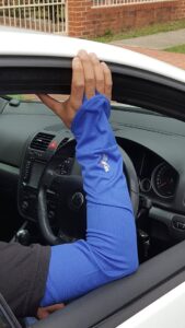Driver Sun Protection Sleeve Blue closeup with the loop around the finger to hold it in place